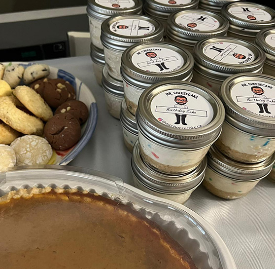 Mr. Cheesecake products laid out on a table